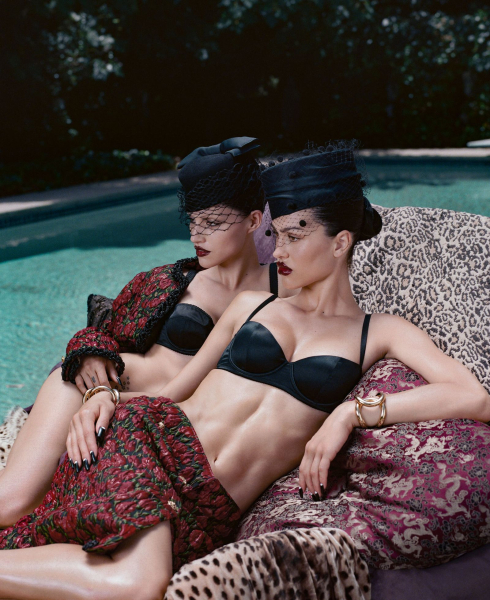Amelia Gray and Gabbriette posing in front of pool for their Allure cover shoot