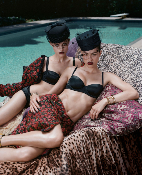 Amelia Gray and Gabbriette posing in front of pool for their Allure cover shoot